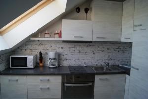 Kuchyňa alebo kuchynka v ubytovaní Stelle Apartments