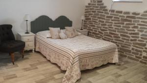 Postel nebo postele na pokoji v ubytování La Bastide du Moulin - Mont St Michel