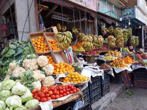 a market with lots of fruits and vegetables on display at Sunflower Guest House Luxor West Bank in Luxor