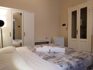 Een bed of bedden in een kamer bij Elite Milano Apartments