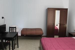 Ein Bett oder Betten in einem Zimmer der Unterkunft B&B Giove&Nettuno
