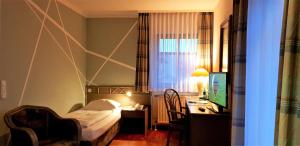 Postel nebo postele na pokoji v ubytování Art-Hotel Erlangen