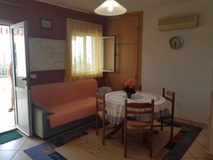 a small room with a table and a bed at Apartman Nino in Okrug Donji