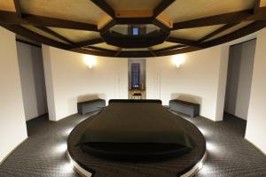 a room with a bed in the middle of it at AirHome - Water Tower in Sõrve