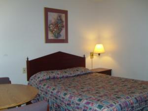 Postel nebo postele na pokoji v ubytování Stagecoach Inn Motel