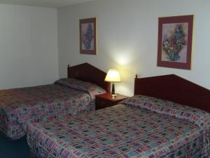 Postel nebo postele na pokoji v ubytování Stagecoach Inn Motel