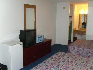 Postel nebo postele na pokoji v ubytování Stagecoach Inn Motel
