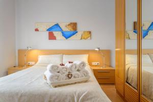 Кровать или кровати в номере Apartamento "El Lilà" - Parking incluido