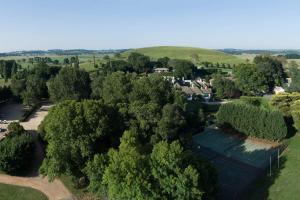 an overhead view of a village with trees and houses at Peppers Manor House in Sutton Forest