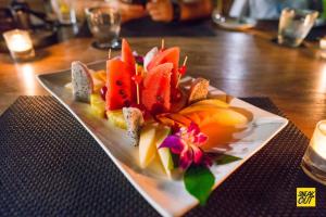 a plate of food with fruit on a table at My sweet home@ChiangMai in Ban Dong