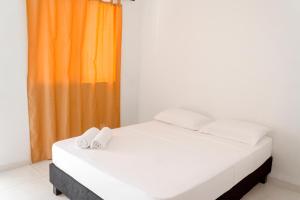 Postel nebo postele na pokoji v ubytování Victoria Imperial Hotel