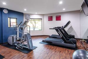 a gym with treadmill and ellipticals in a room at Comfort Suites NW Dallas Near Love Field in Dallas