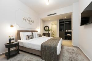 Ένα ή περισσότερα κρεβάτια σε δωμάτιο στο The Mood Luxury Rooms