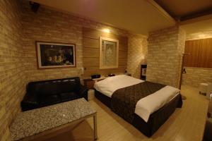 Voodi või voodid majutusasutuse Hotel Allure (Adult Only) toas