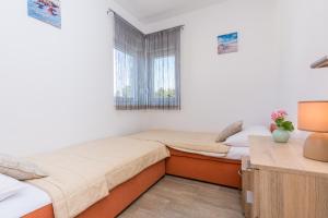Postel nebo postele na pokoji v ubytování Pasko 2 modern furnished ap for 7