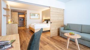 Postel nebo postele na pokoji v ubytování Hotel Trattlerhof