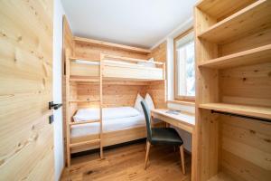 Postel nebo postele na pokoji v ubytování Hotel Trattlerhof