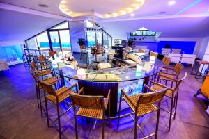 a dining room with a large table and chairs at Princessa Hotel in Jounieh