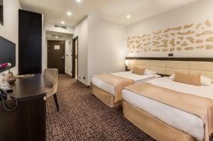 Posteľ alebo postele v izbe v ubytovaní Hotel Diplomat + 37 fotografií