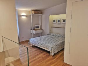 Ένα ή περισσότερα κρεβάτια σε δωμάτιο στο Loft Bellavista Volterra