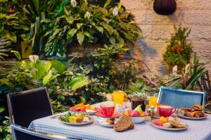 a table with plates of food on top at Prima Park Hotel Jerusalem in Jerusalem +24 photos