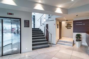 a lobby of a building with a staircase at Hotel Diplomat in Zagreb