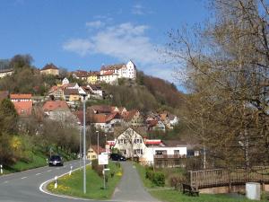 a town on a hill with houses and a road at Ferienhaus Heinrich in Egloffstein