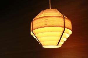 a chandelier hanging from the ceiling in a room at Hotel Banister Kyoto in Kyoto