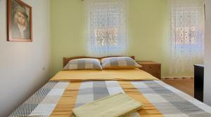 Postel nebo postele na pokoji v ubytování Apartmani More Krk