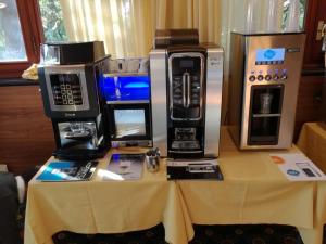 a table with three microwaves on top of it at Hotel Bellavista in Stenico