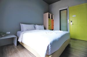 Postel nebo postele na pokoji v ubytování iSanook Hostel