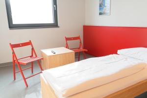 Letto o letti in una camera di Jugendgästehaus Brigittenau &Brigittenau Youth Palace