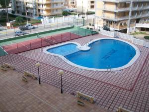 a large swimming pool on top of a building at Infante - Primera Línea de Playa in Playa de Gandia