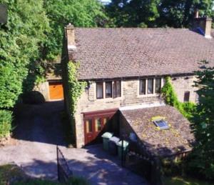 an aerial view of a house with a garage at Winwood Apartment in Holmfirth