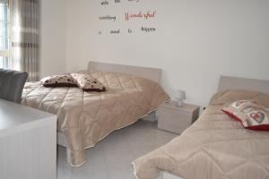 Postel nebo postele na pokoji v ubytování B&B Casa Di Lauro