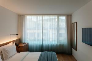 Postel nebo postele na pokoji v ubytování Hotel Arpoador