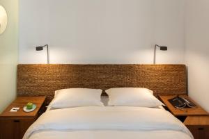 Postel nebo postele na pokoji v ubytování Hotel Arpoador