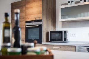 Dapur atau dapur kecil di Dorf Alm Ferienwohnung +4 gambar