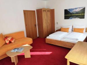 Postel nebo postele na pokoji v ubytování Hotel Rupertihaus