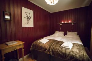 Postel nebo postele na pokoji v ubytování Henning Ski Lodge