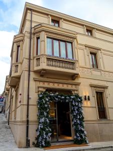 a building with areath on the front of it at Torrione Hotel in Reggio Calabria