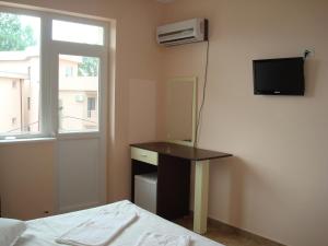 Et tv og/eller underholdning på Casa Alex + 21 billeder