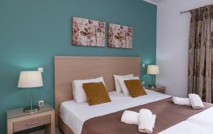 Postel nebo postele na pokoji v ubytování Sunrise Beachfront Apartment