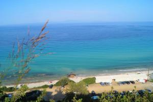 a view of a beach with a group of cars at Poseidon Seaview Studios in Afitos