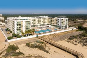 an aerial view of a resort on the beach at Hotel Apartamento Dunamar in Monte Gordo