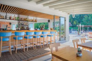 A restaurant or other place to eat at Dominoes Corfu