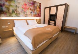 Postel nebo postele na pokoji v ubytování Family Hotel Schloss Rosenegg