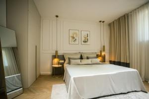 Tempat tidur dalam kamar di Club boutique rooms