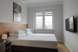 Rúm í herbergi á MoHo XL