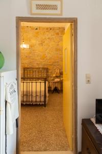 A bed or beds in a room at Iliopetra House